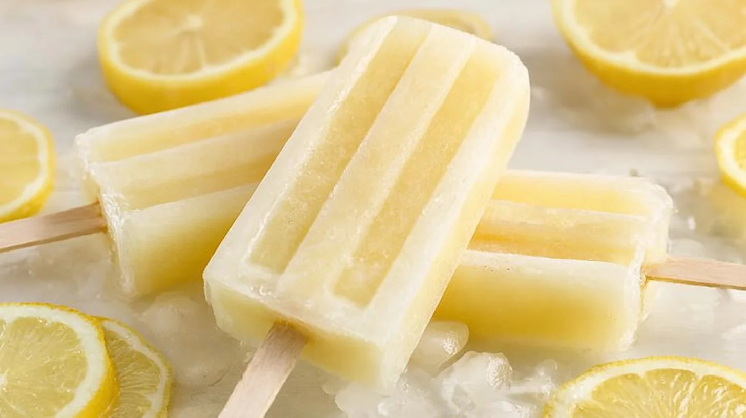 Refreshing lemonade popsicles in a colorful ice pop mold.